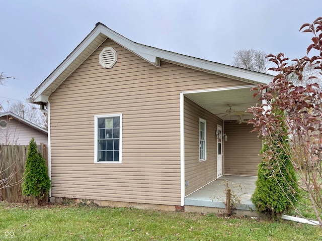 view of side of home featuring ceiling fan