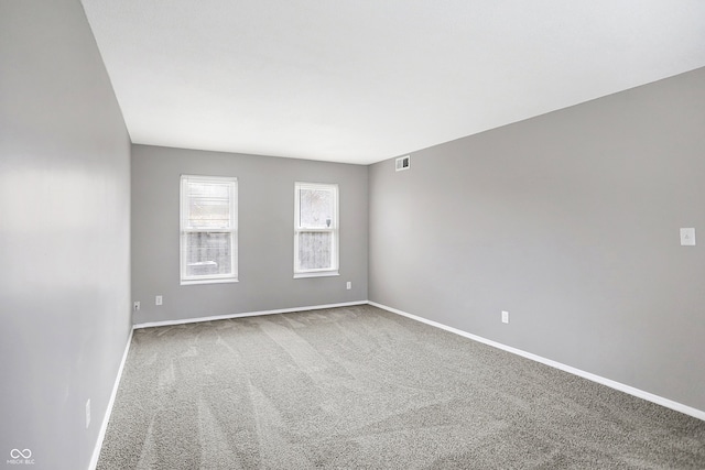 spare room featuring carpet flooring