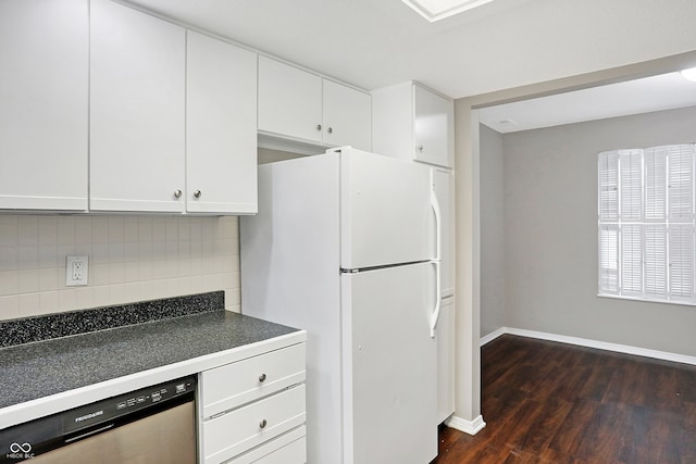 kitchen with backsplash, white cabinets, white refrigerator, stainless steel dishwasher, and dark hardwood / wood-style floors