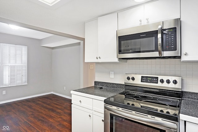 kitchen featuring decorative backsplash, dark hardwood / wood-style flooring, white cabinets, and stainless steel appliances