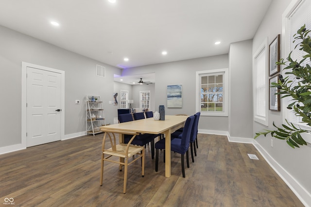 dining area featuring ceiling fan and dark wood-type flooring