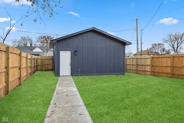 view of outdoor structure with a lawn