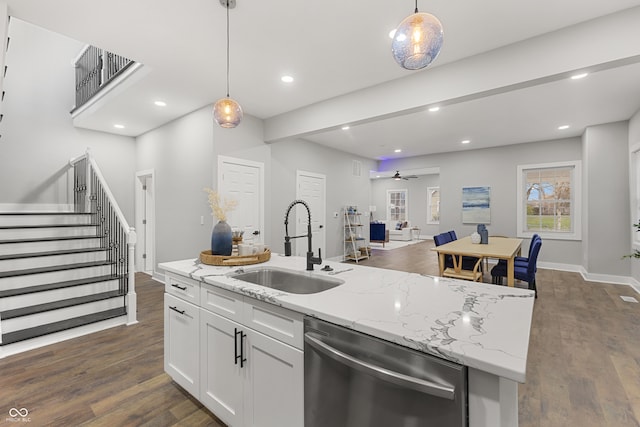 kitchen featuring dishwasher, white cabinets, sink, hanging light fixtures, and ceiling fan