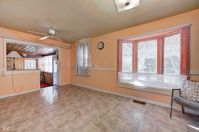 unfurnished room with ceiling fan