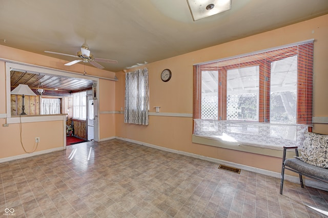 80 S Mickley Ave, Indianapolis, IN 46241 - unfurnished living room with baseboards and a ceiling fan