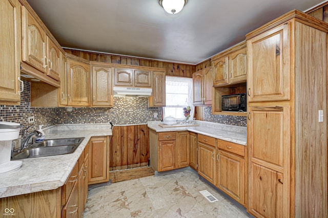 80 S Mickley Ave, Indianapolis, IN 46241 - kitchen with under cabinet range hood, decorative backsplash, light countertops, and black microwave