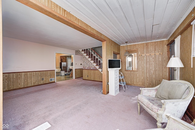 80 S Mickley Ave, Indianapolis, IN 46241 - living area featuring wooden walls, stairway, carpet flooring, and wainscoting