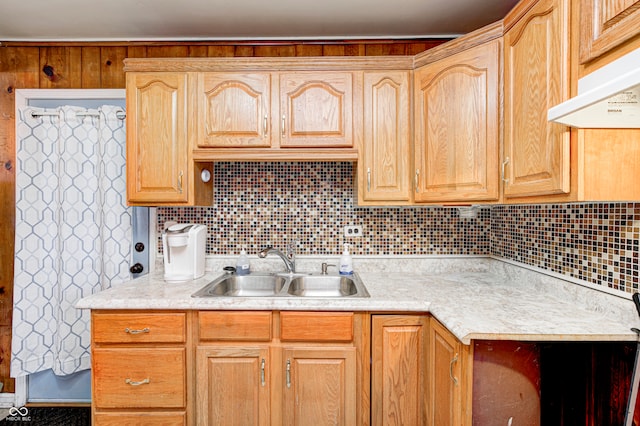 kitchen with backsplash, sink, and extractor fan