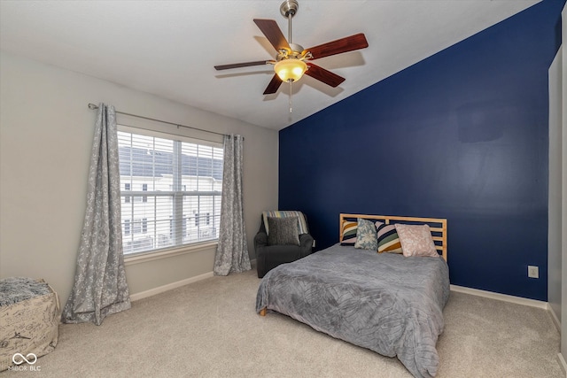 carpeted bedroom featuring ceiling fan and lofted ceiling