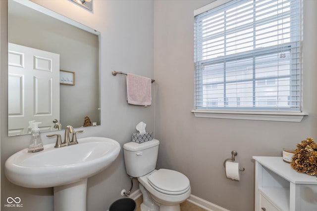 bathroom featuring toilet and sink