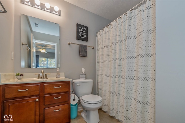 bathroom with vanity, tile patterned flooring, a shower with shower curtain, toilet, and a textured ceiling