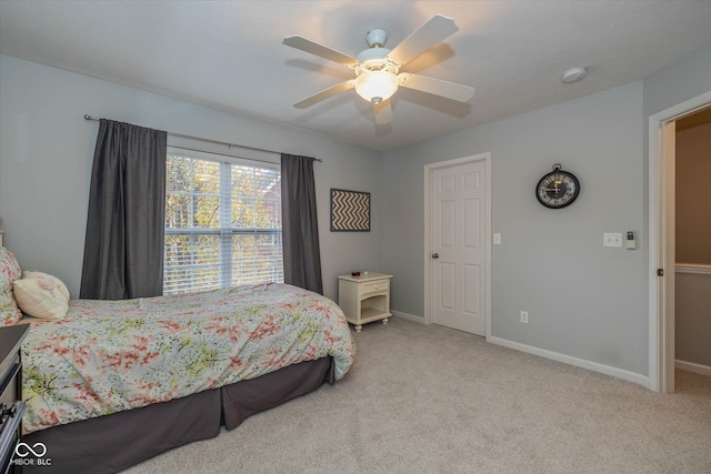 bedroom with ceiling fan and light colored carpet