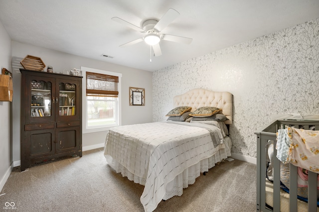 bedroom with ceiling fan and light colored carpet