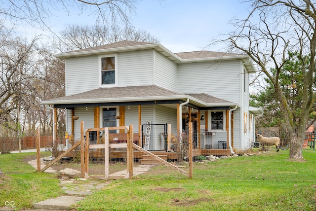 view of front of property with a porch and a front yard