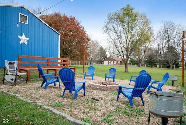 view of yard featuring an outdoor fire pit