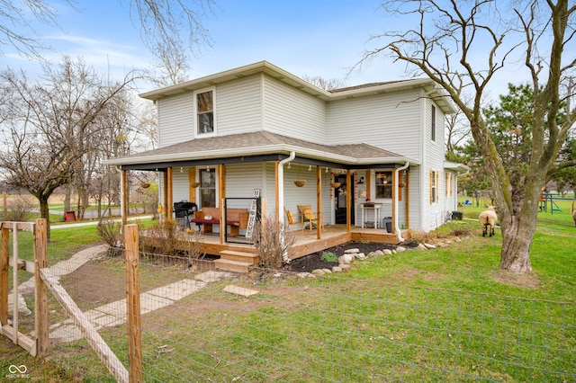 farmhouse-style home featuring a front lawn and a porch