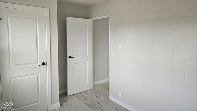 unfurnished bedroom with light wood-type flooring