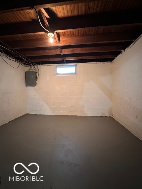 basement with electric panel and wood ceiling