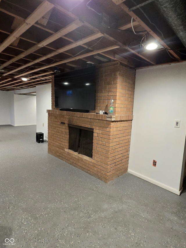 basement with a brick fireplace