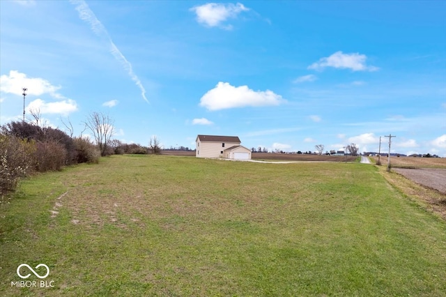 view of yard with a rural view