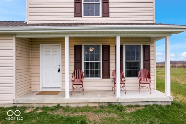 doorway to property featuring covered porch