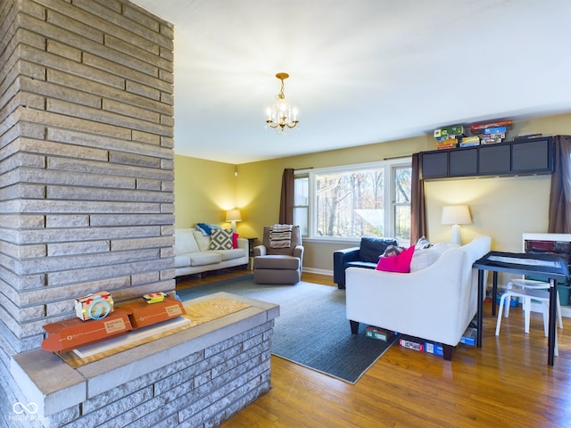 living room with wood-type flooring and an inviting chandelier