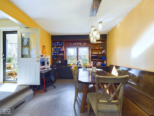 view of carpeted dining space