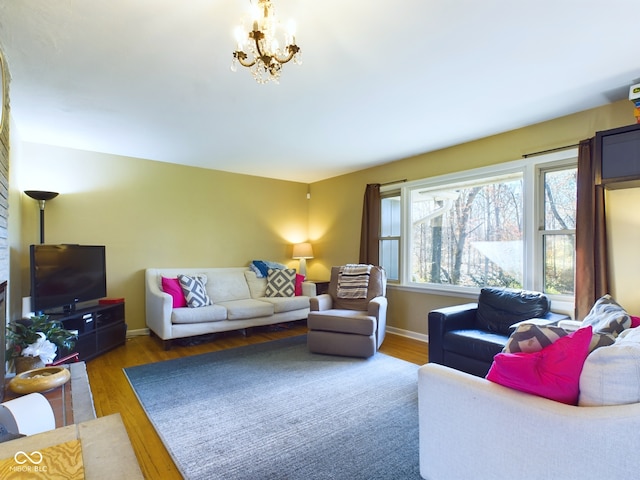 living room featuring hardwood / wood-style flooring and a notable chandelier