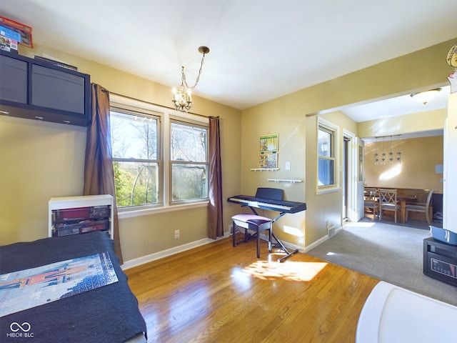 interior space featuring a notable chandelier and hardwood / wood-style flooring