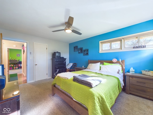 carpeted bedroom featuring ceiling fan