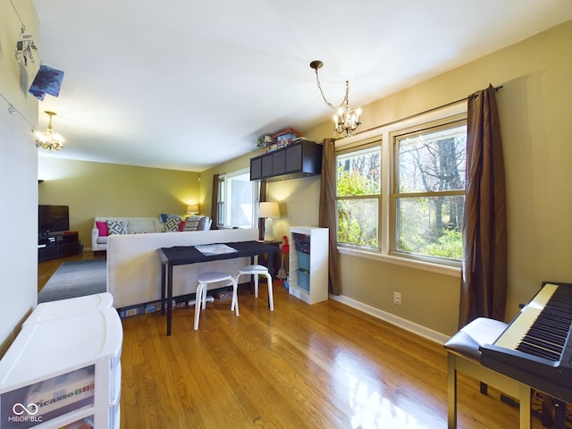 kitchen featuring a chandelier, decorative light fixtures, and light wood-type flooring