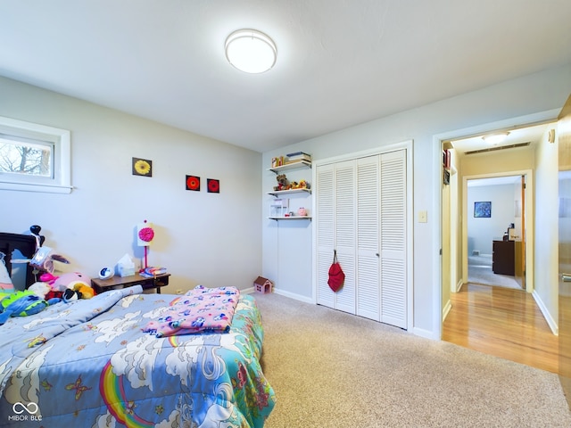 carpeted bedroom featuring a closet