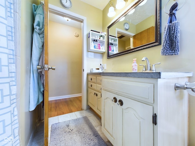 bathroom featuring vanity and hardwood / wood-style flooring