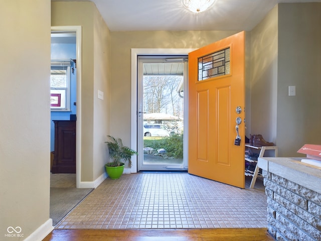 foyer entrance featuring tile patterned flooring