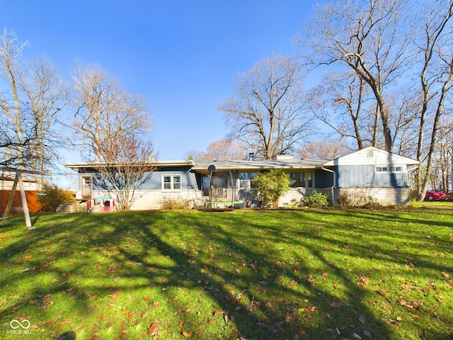 rear view of house with a lawn