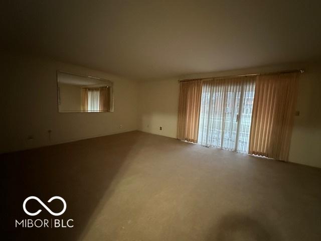 empty room featuring carpet flooring