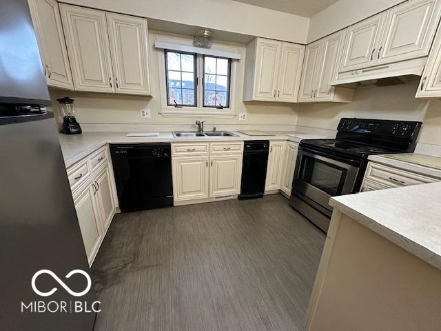 kitchen featuring white cabinetry, black dishwasher, sink, and electric range oven