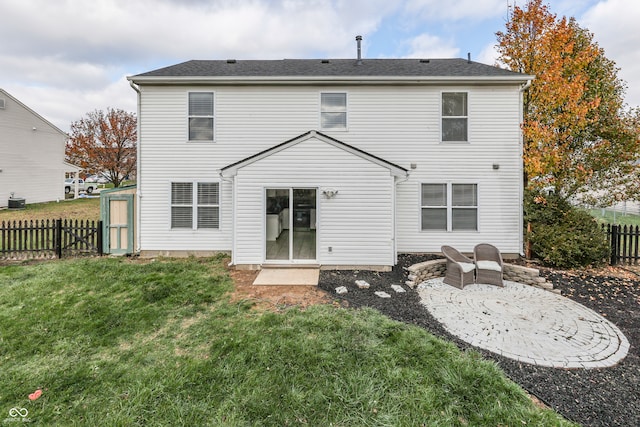 rear view of house with a patio area and a lawn