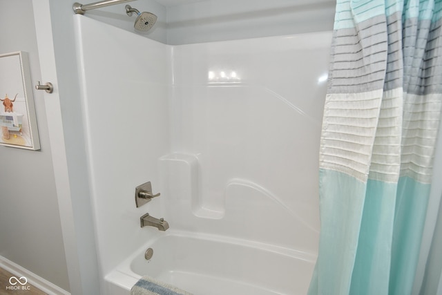 bathroom with shower / bath combination with curtain