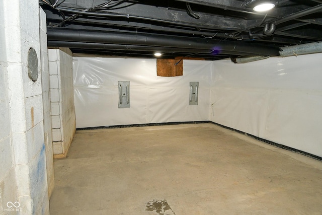 basement featuring electric panel