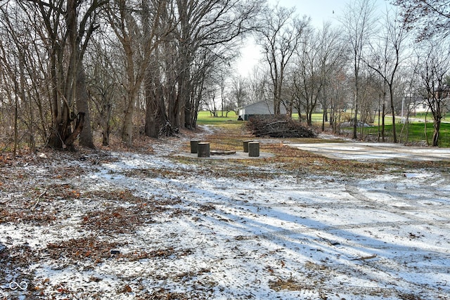 view of yard layered in snow