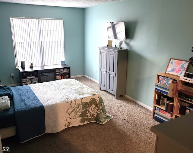 bedroom featuring light carpet