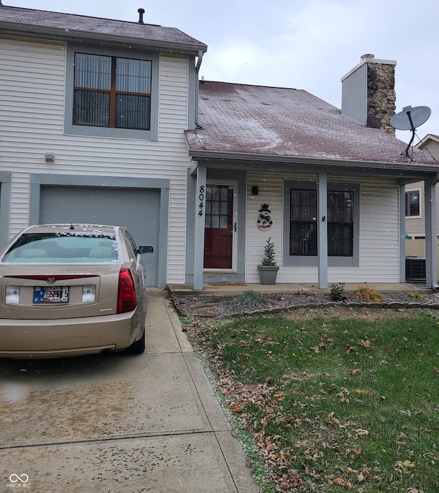 view of front of house featuring covered porch and a garage