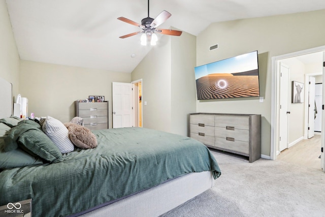 carpeted bedroom with vaulted ceiling and ceiling fan