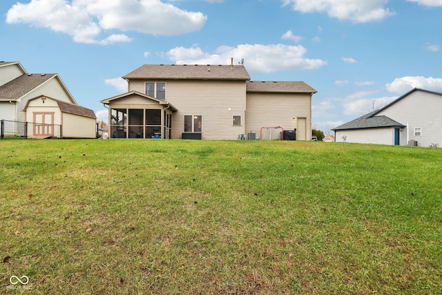 back of house with a sunroom and a yard