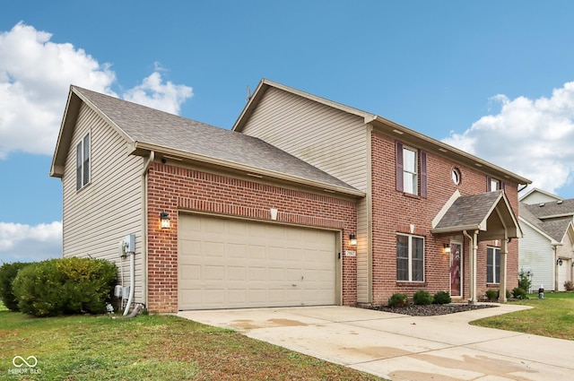 view of front of home featuring a garage and a front yard