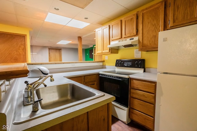 1510 S Greensboro Pike, New Castle, IN 47362 - kitchen with kitchen peninsula, white appliances, a paneled ceiling, and sink