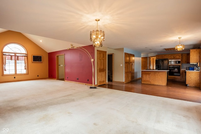 1510 S Greensboro Pike, New Castle, IN 47362 - unfurnished living room featuring hardwood / wood-style floors, lofted ceiling, and an inviting chandelier