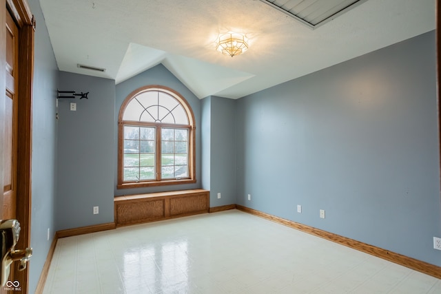 1510 S Greensboro Pike, New Castle, IN 47362 - unfurnished room featuring a textured ceiling and lofted ceiling