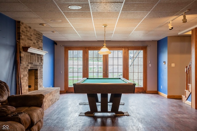 1510 S Greensboro Pike, New Castle, IN 47362 - recreation room featuring a paneled ceiling, wood-type flooring, pool table, and a brick fireplace
